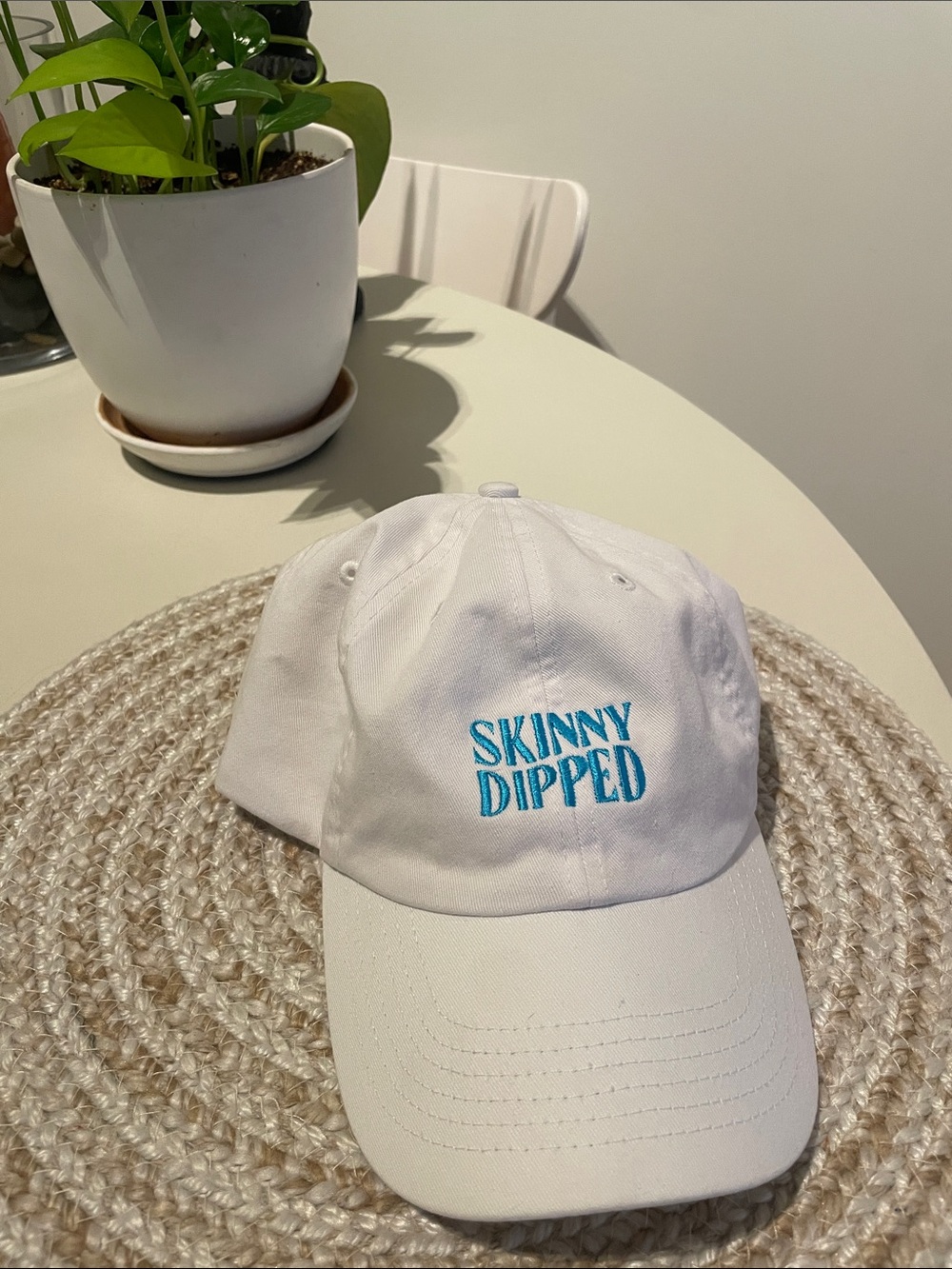 White Baseball Cap with Teal Logo (Skinny Dipped)